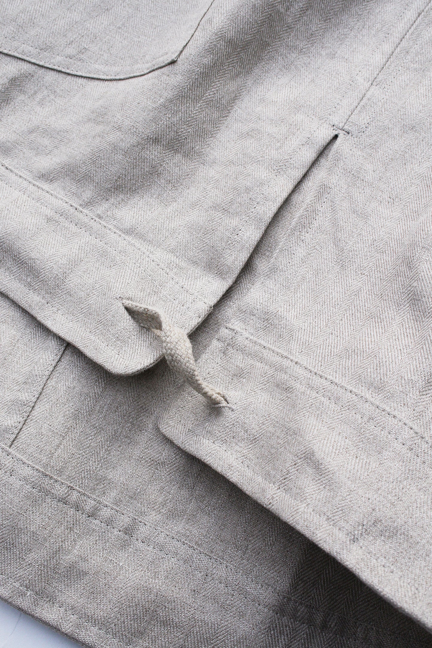 O PROJECT DENSE HERRINGBONE SLEEVELESS JACKET - KINARI
